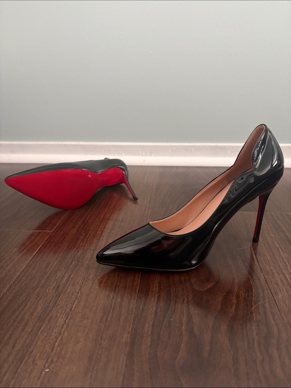 Black Patent Pointed-Toe Stiletto Pumps with Red Sole